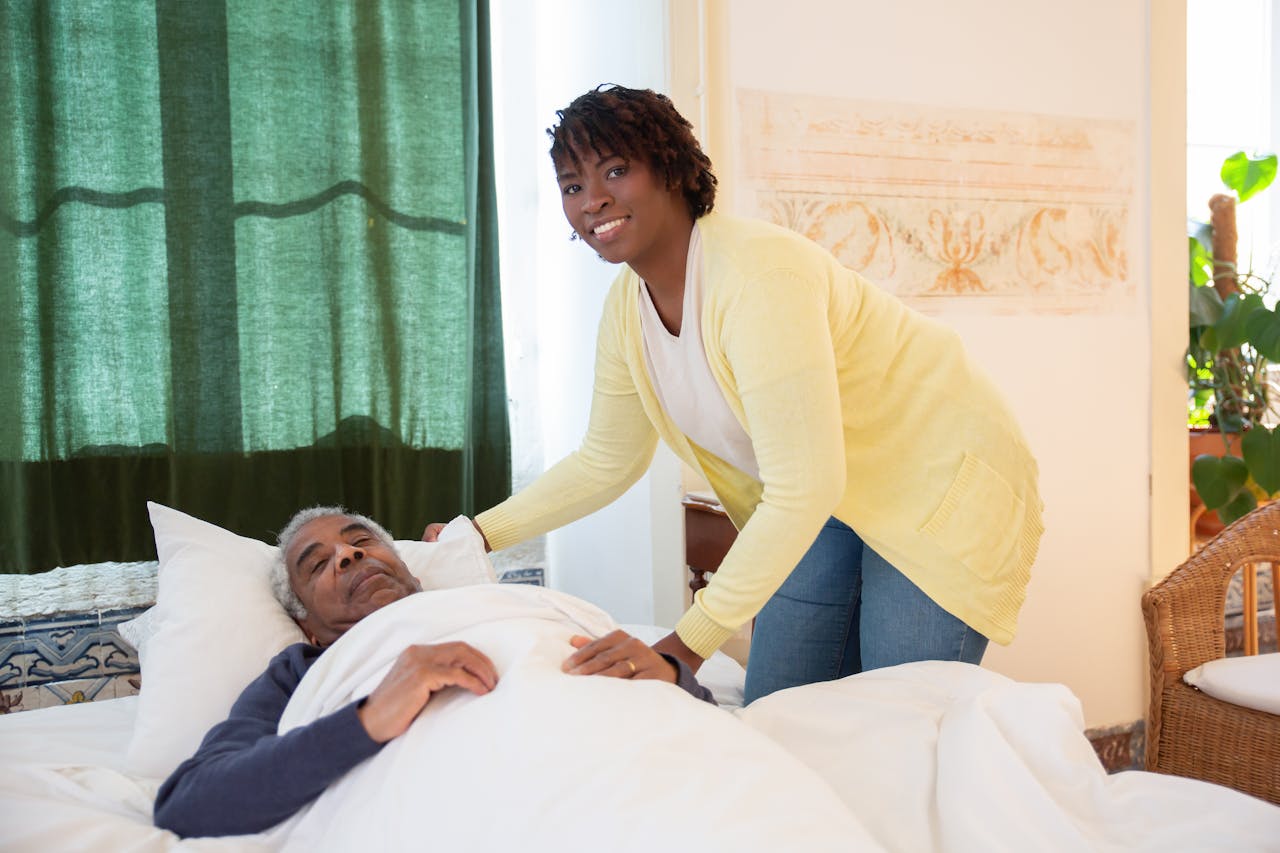 Mastering the First Impression: Your intriguing post title goes here A woman tending to an elderly man in a bright and warm bedroom, symbolizing care and family support.